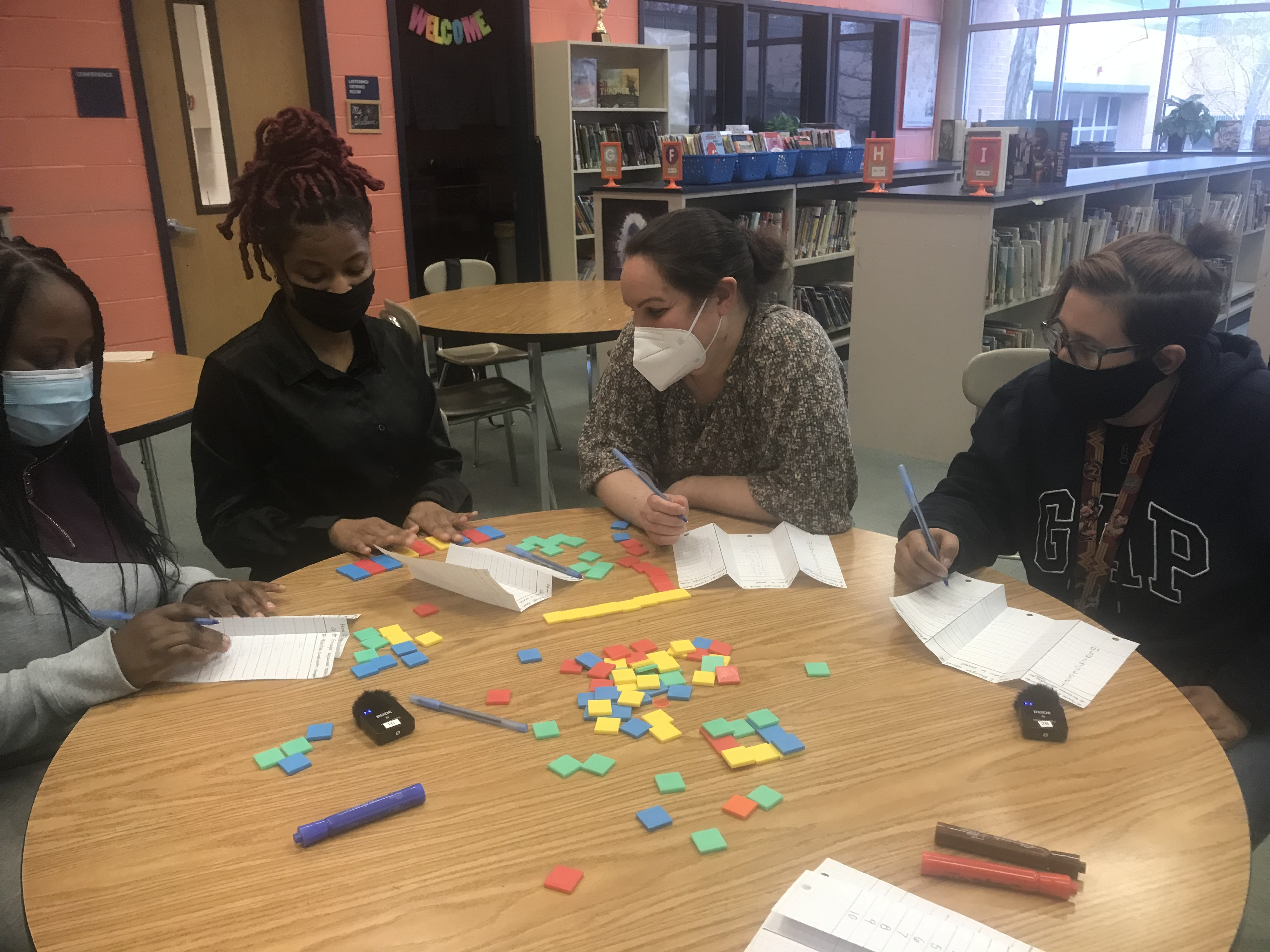 Image of parents and teachers working together.